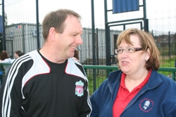 Eddie Sullivan, head community coach for Liverpool FC, chats with Connor's Sister Valerie Thom of the Church Army during a training session at Paisley Park, Shankill.